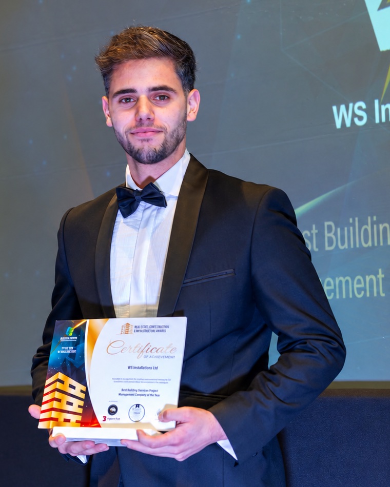 Wayne Schembri, director of WS Installations, holding an award at the 2026 ceremony